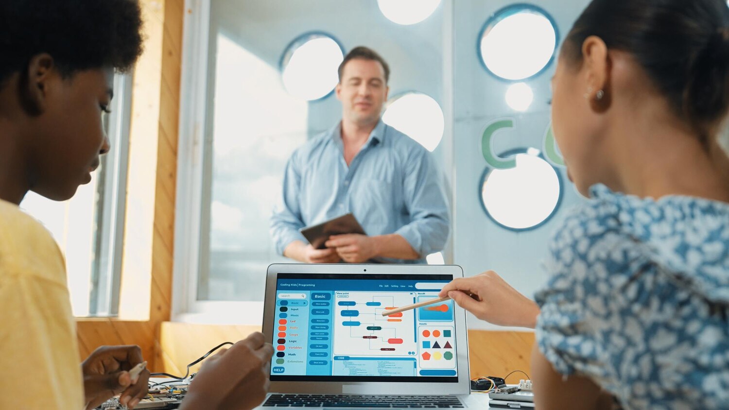 UX researchers conducting moderated tests while monitoring an analytics dashboard to inform enterprise UX decisions