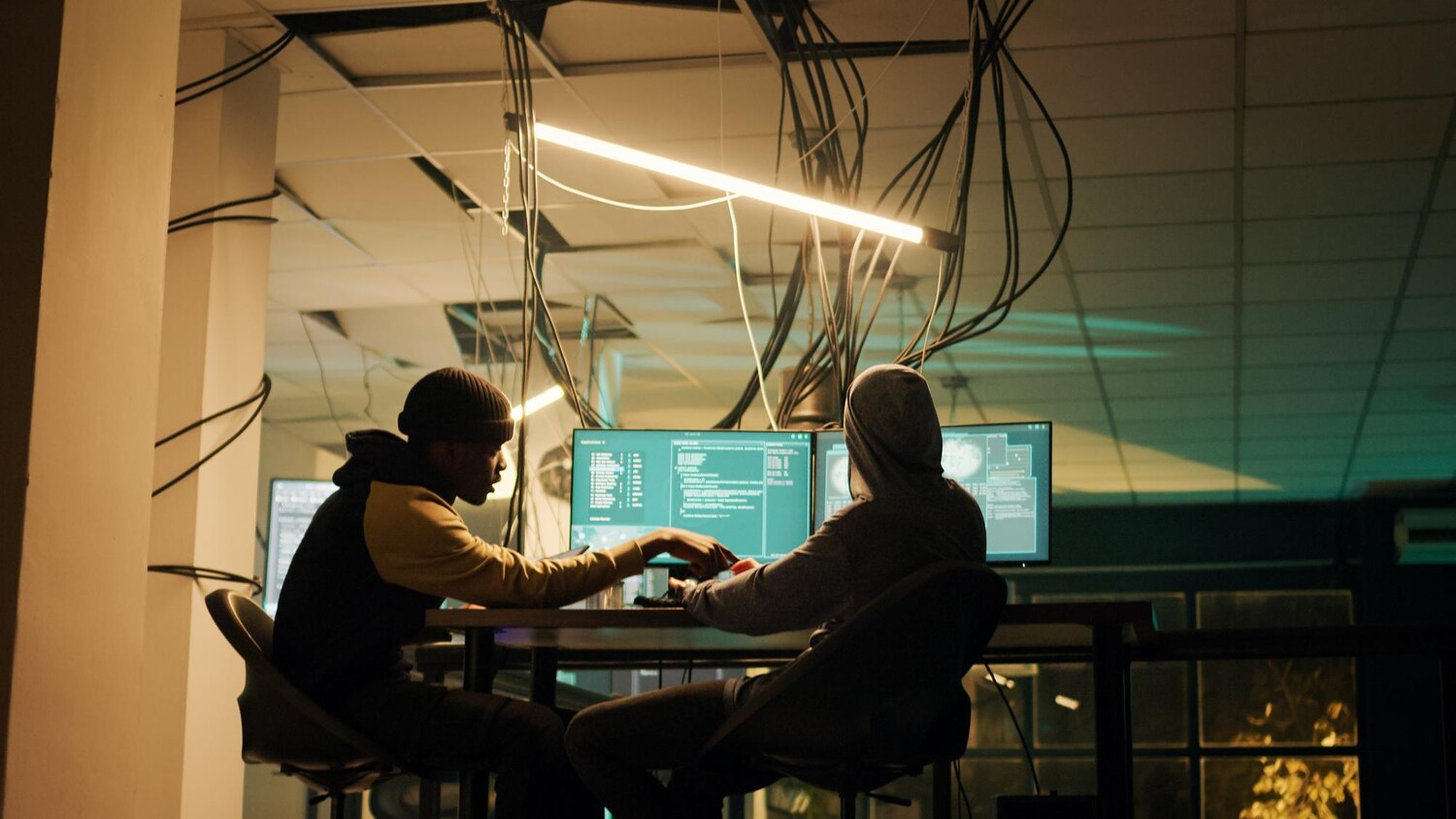 Engineers pairing to implement retries and circuit breakers in an integration service within a collaborative software team workspace