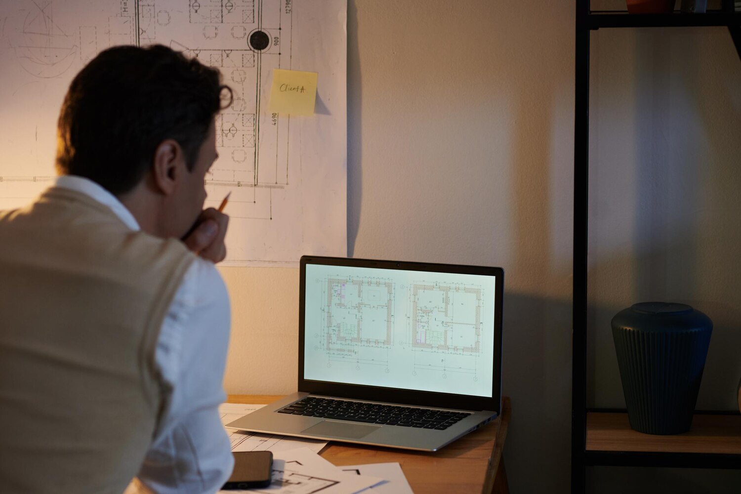 Senior engineer evaluating build vs buy options with system diagrams and API contracts for a critical integration decision