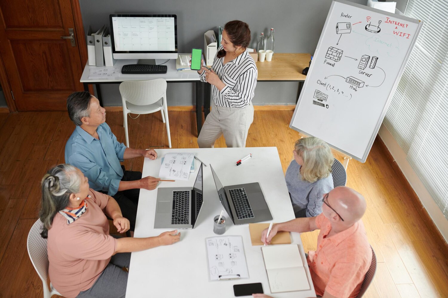 Cross-functional product and engineering team collaborating on systems integration planning to execute the transformation roadmap