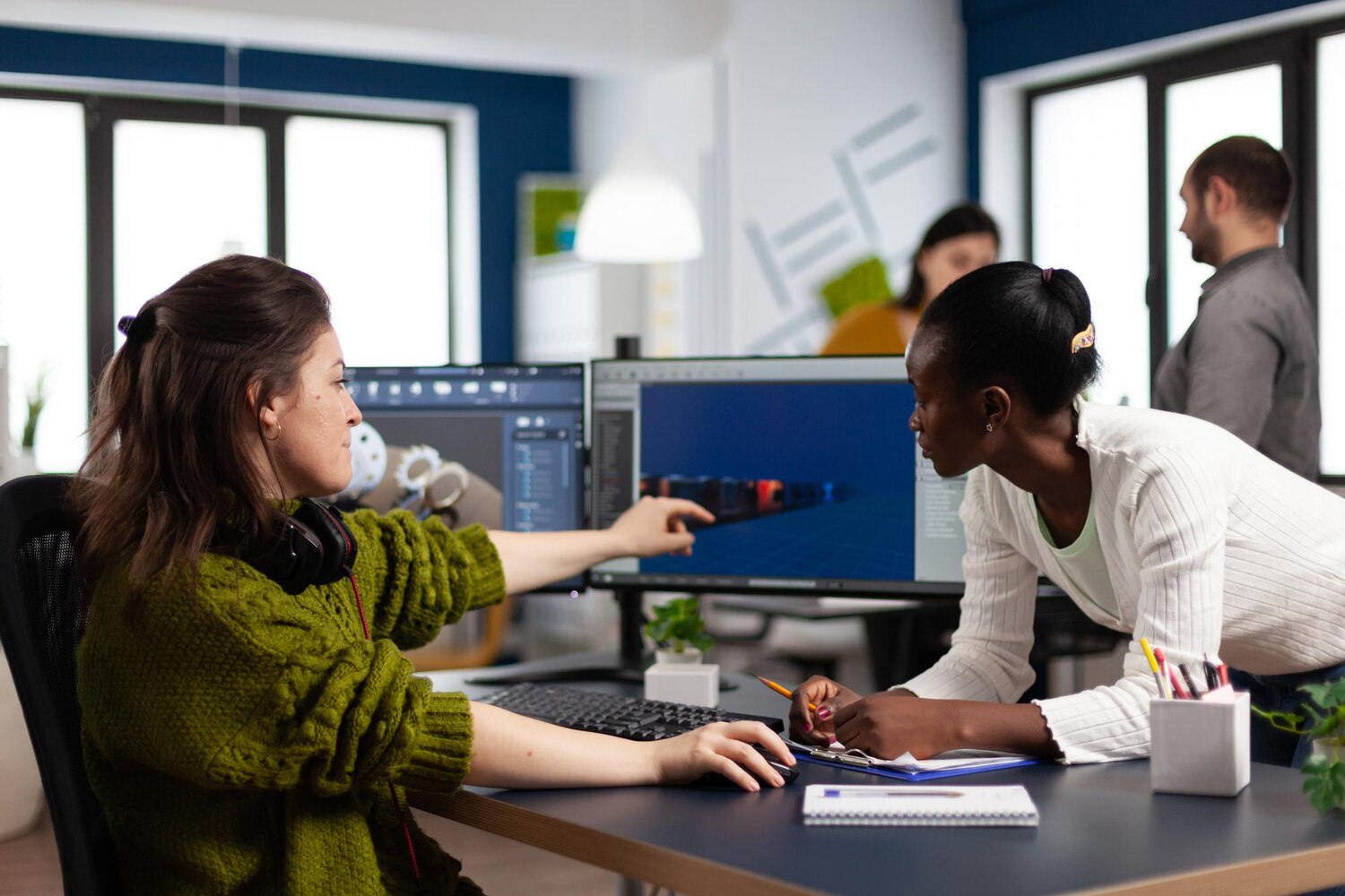 Engineers reviewing diagrams and code for AI platform components during a design session