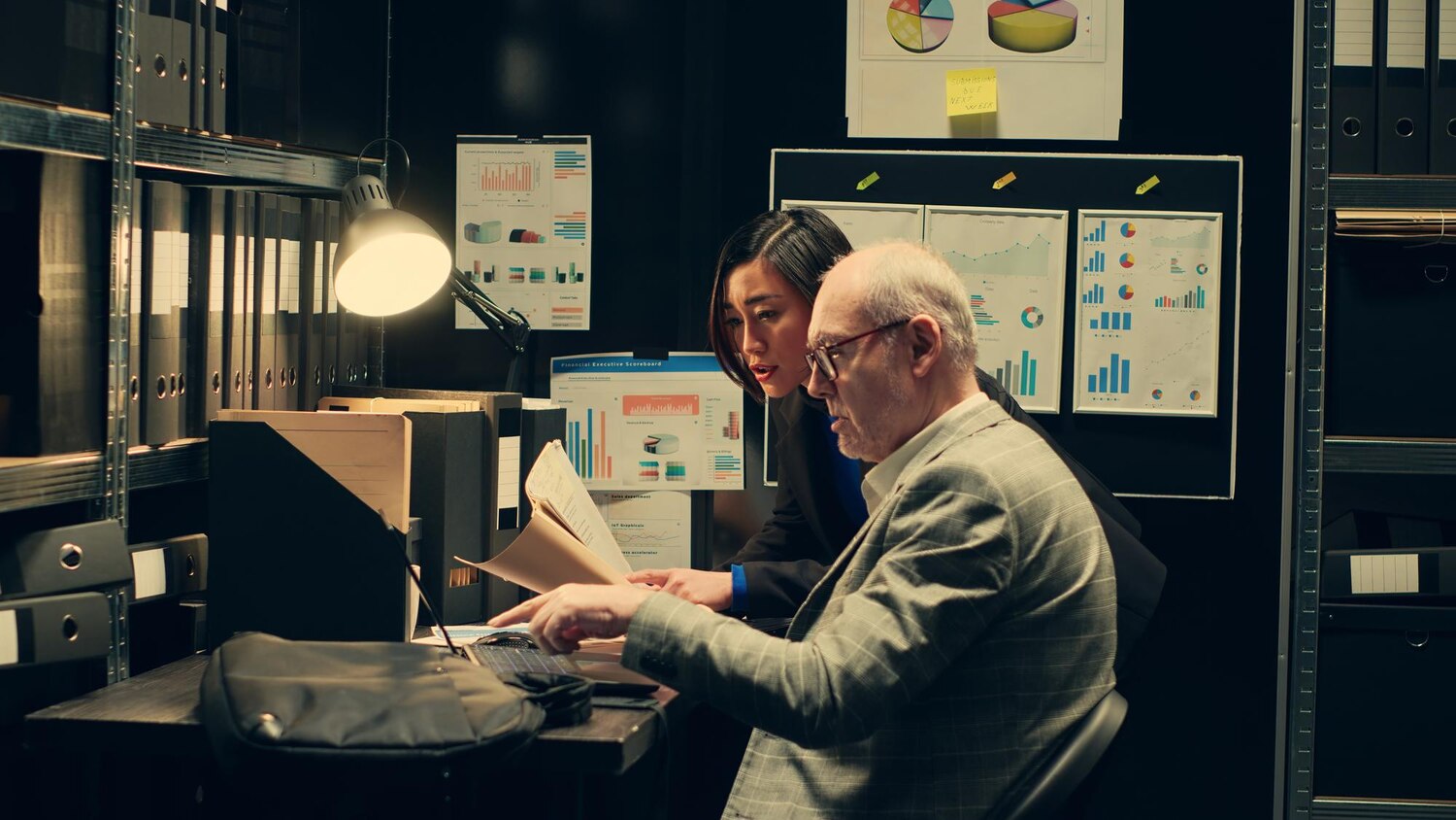 Senior architect and CFO analyzing risk heatmaps and portfolio trade-offs to adjust a transformation roadmap