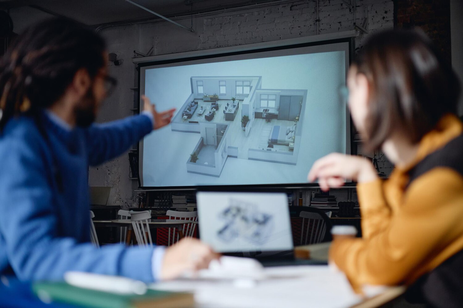Architect explains state machines and event contracts to a DevOps team, detailing decisions behind the automation architecture
