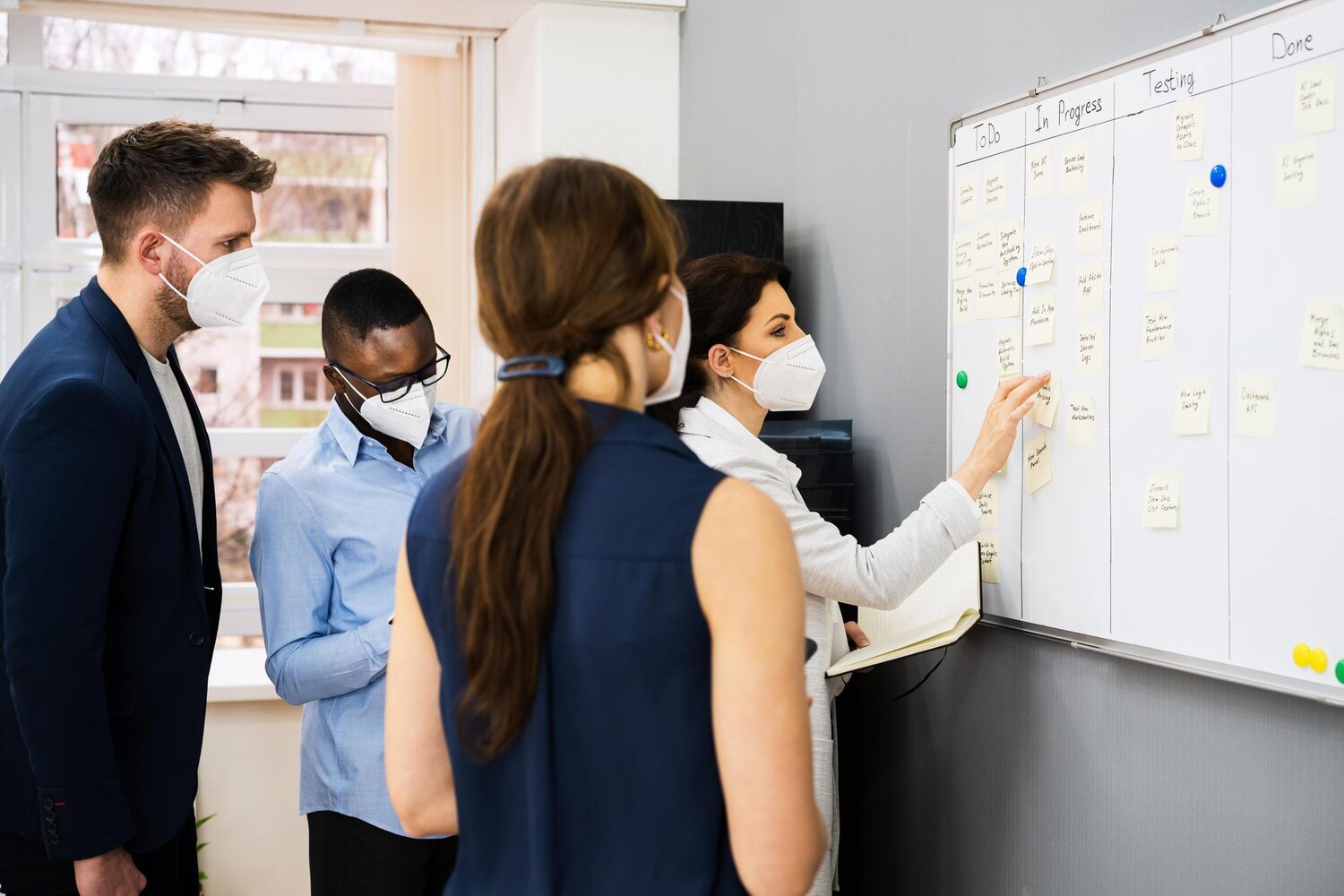 Product, design, and engineering team collaborating on customer journey maps to prioritize the transformation roadmap