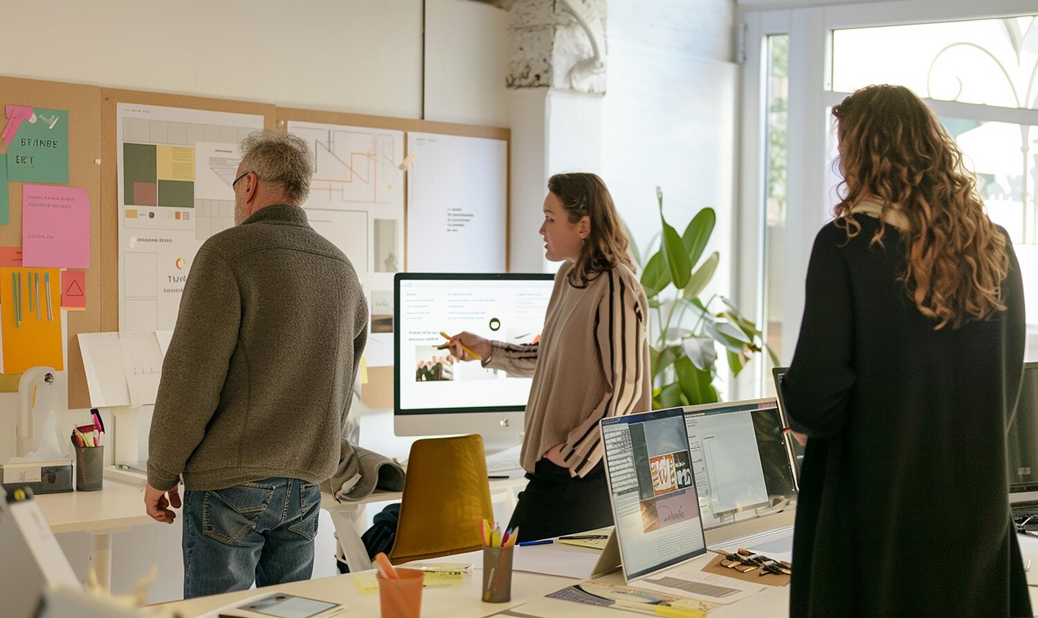 Cross‑functional team planning a phased rollout of a new visual brand identity with milestones and risk mitigations