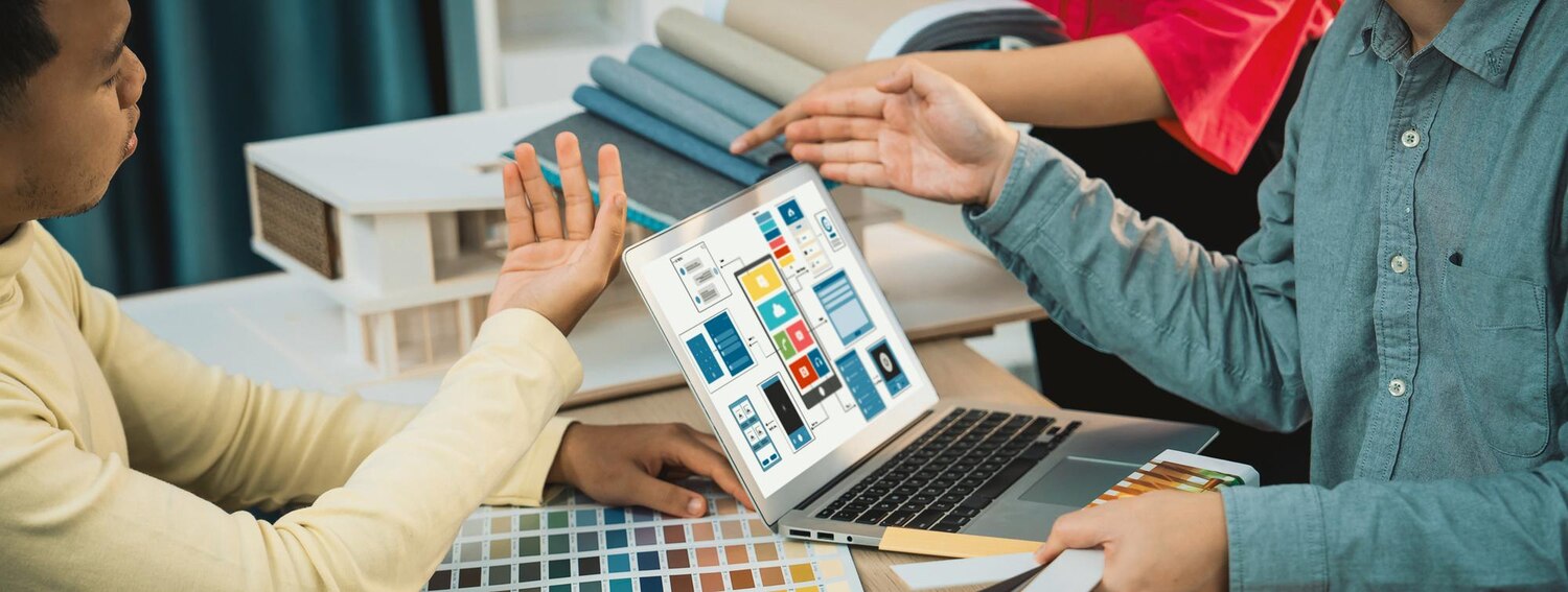 Designers and engineers pairing to implement brand components in a shared Figma and Storybook workspace
