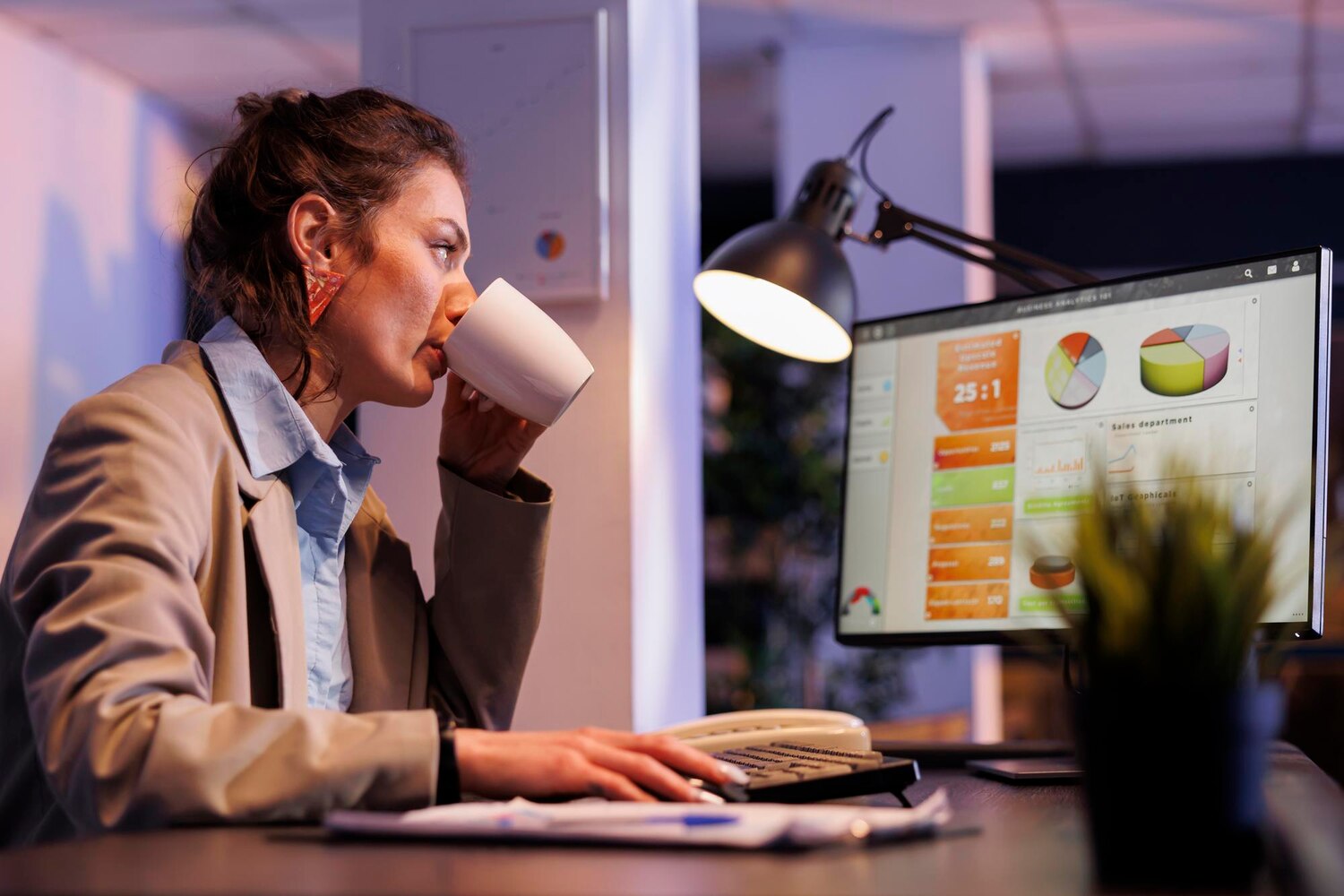 Analyst reviewing funnel charts and heatmaps to explain conversion drop-offs on key B2B pages