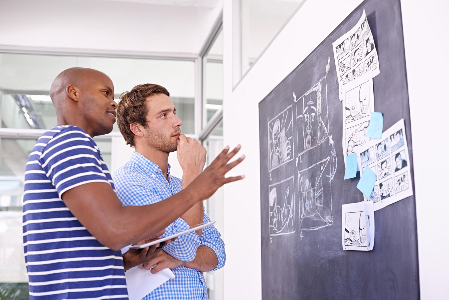 Stakeholders review a brand decision matrix on a digital whiteboard to decide an exception within the brand identity system