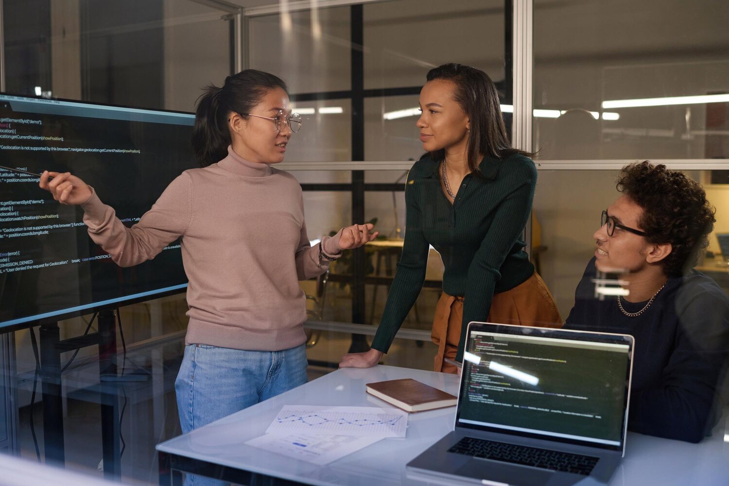 Engineers collaborating on event-driven workflow automation integrations using message queues and observability dashboards