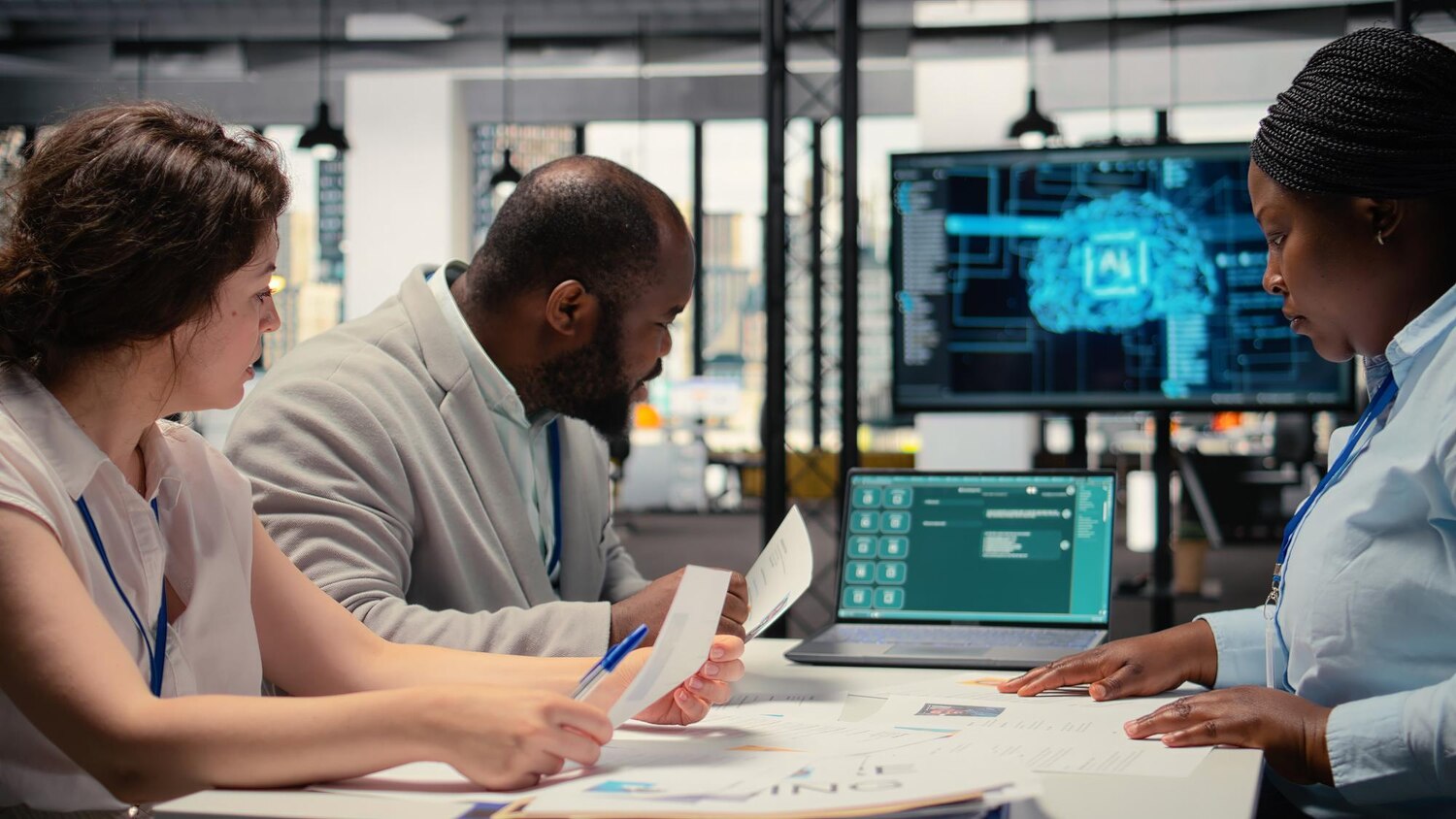 Engineers collaborating on workflow automations with iPaaS and custom APIs, mapping integrations on screens and whiteboards