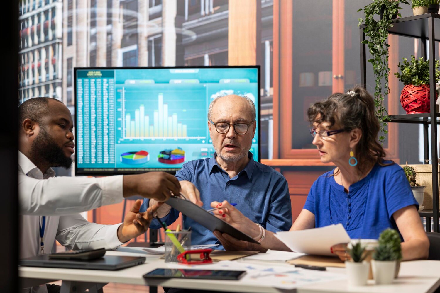 Technical leaders analyze inference cost and latency dashboards to decide build vs buy for an AI platform