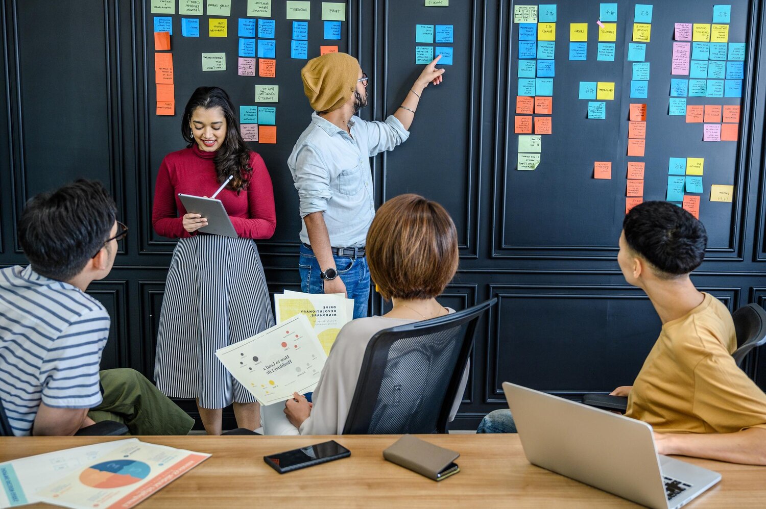 Engineers and PMs planning value slices from the transformation roadmap on a digital kanban