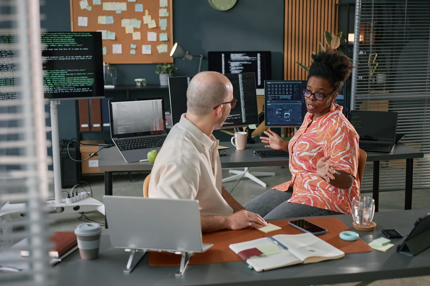 Engineers pair-programming orchestration logic and event subscriptions for workflow automation