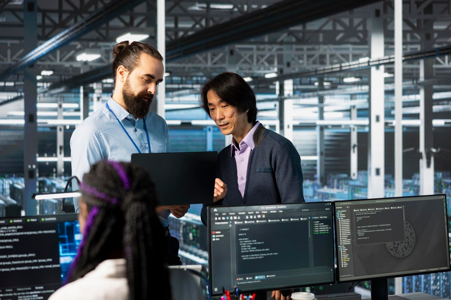 Engineers pairing on CI/CD for model deployment in a DevOps workspace, part of an enterprise AI platform