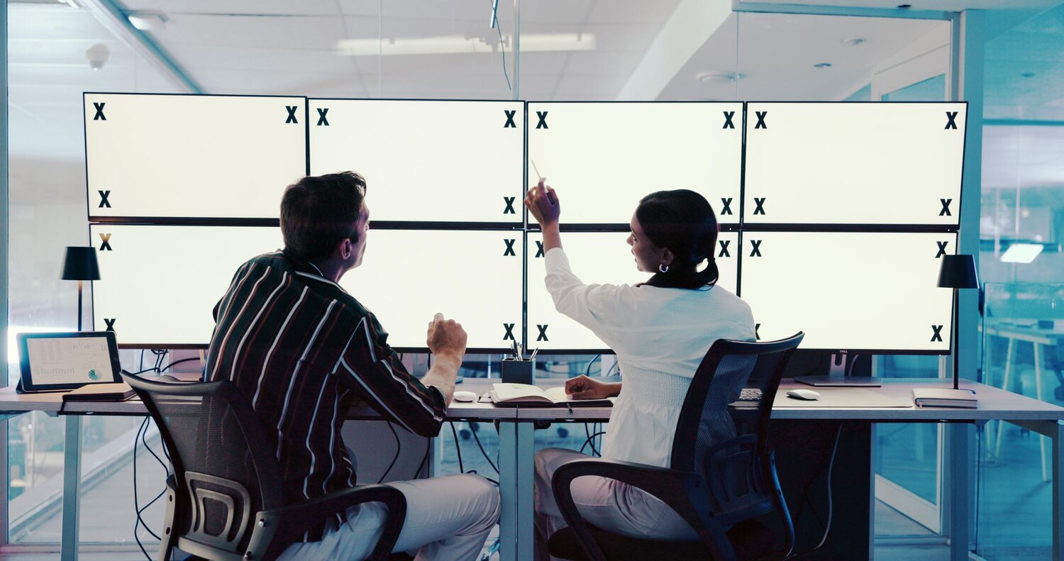 Product managers and engineers collaborating on sprint planning for a major release