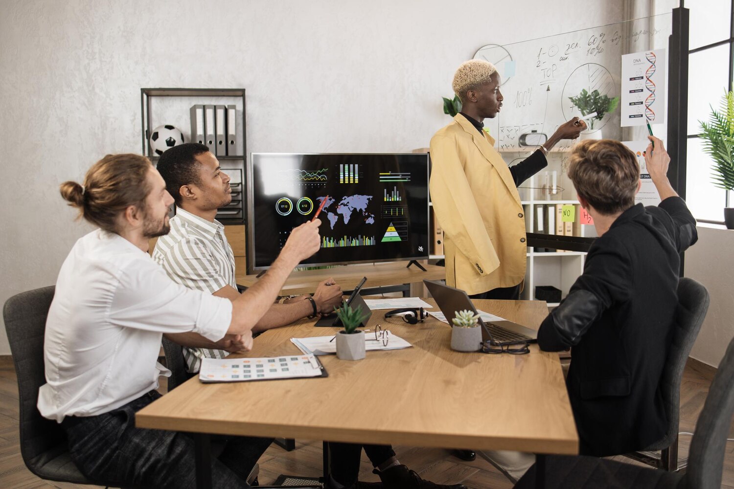 Cross-functional team reviewing integration backlog and deployment plan in a modern tech office