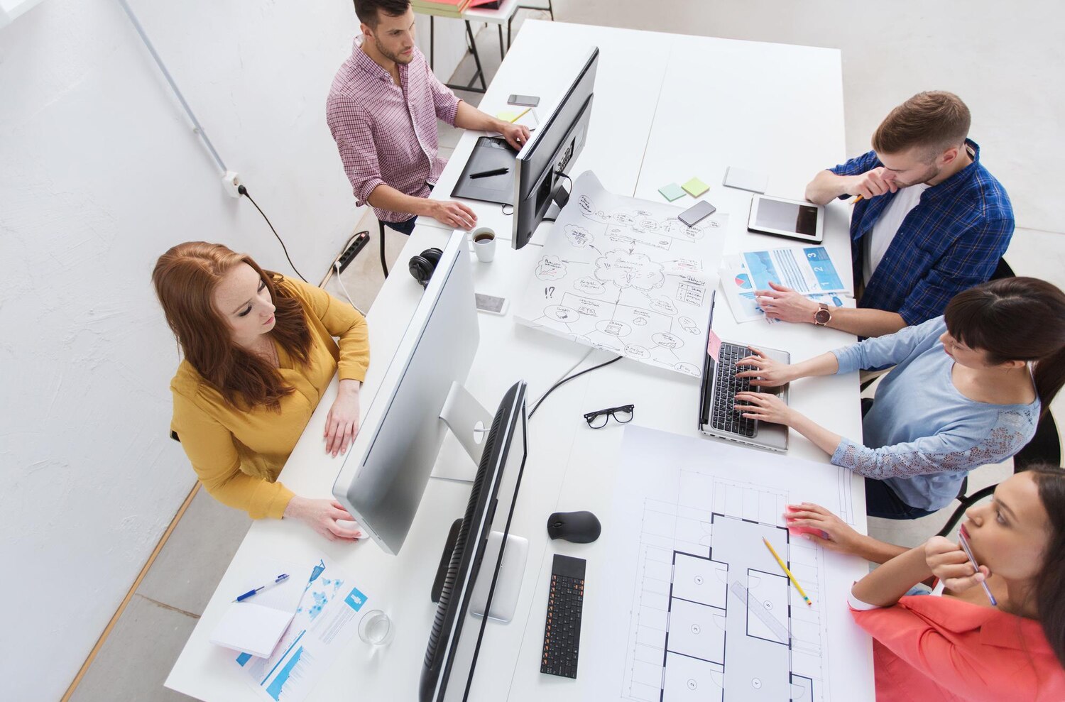 Engineers collaborating on model serving, data pipelines, and guardrail layers for an enterprise AI system
