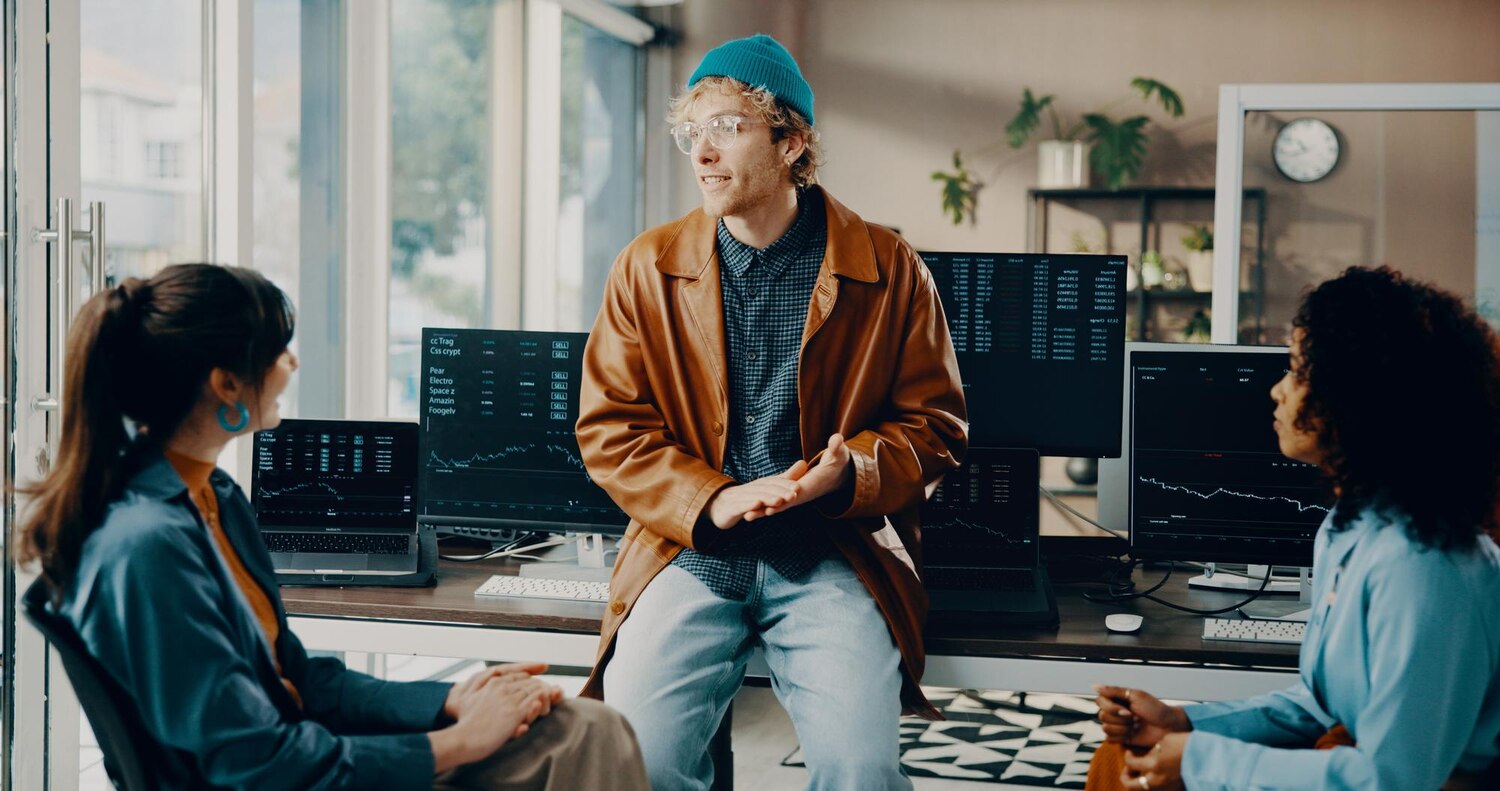 DevOps and engineers collaborate during a code review to implement real user monitoring for performance analytics