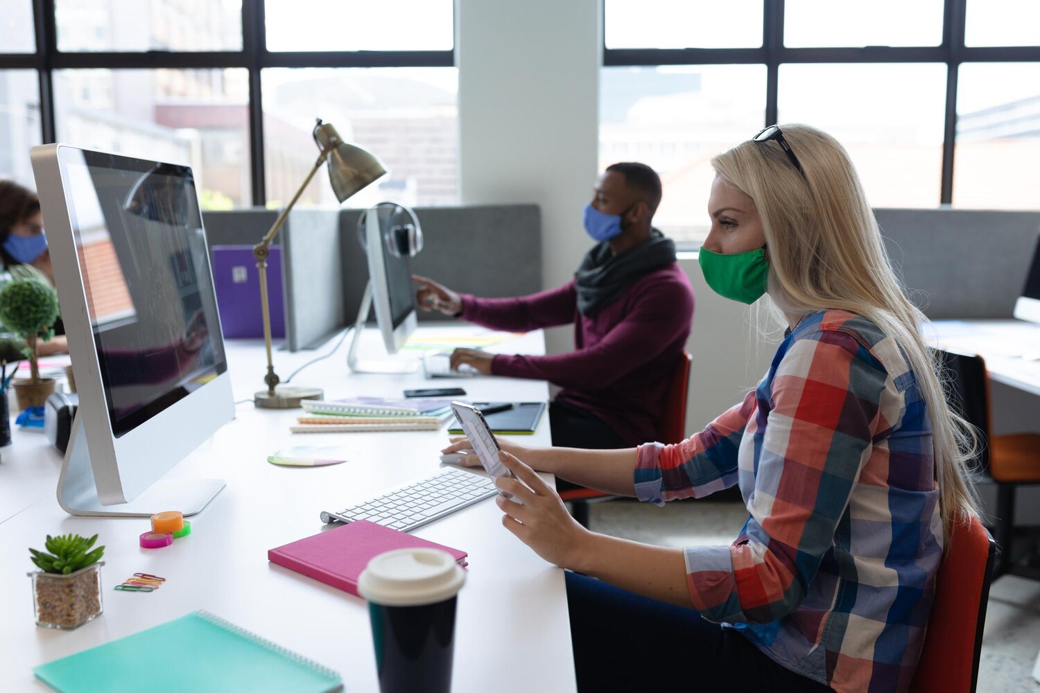 Designers and engineers collaborating on UI patterns in Figma and GitHub to align intent-based journeys