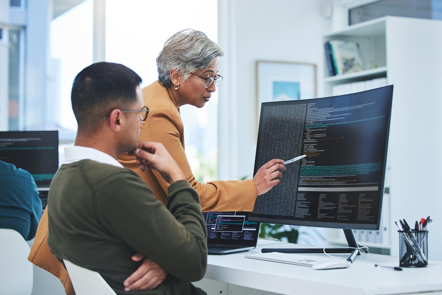 Developers collaborating on API integration tests during a sprint review