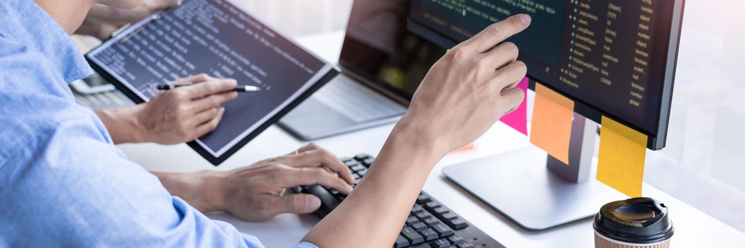 Engineers collaborate during code review to add performance telemetry and analytics tags