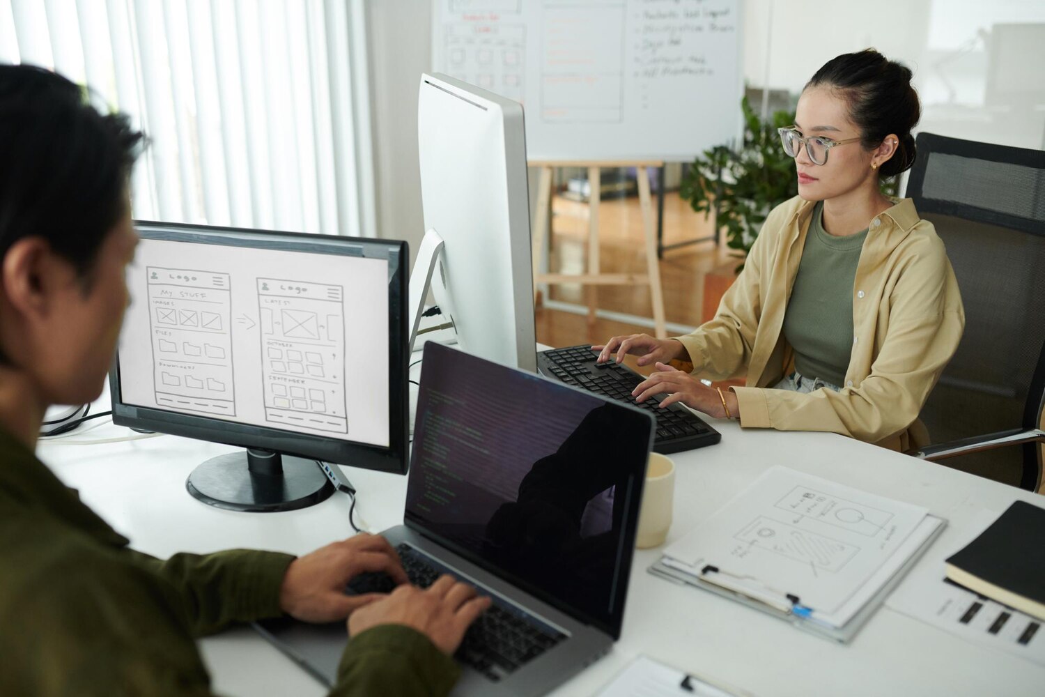 Architect evaluating iPaaS versus custom API integration automation using sequence diagrams on dual monitors