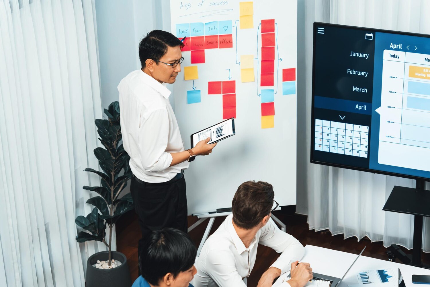 Cross-functional team planning sprints for a complex website redesign in a modern software workspace